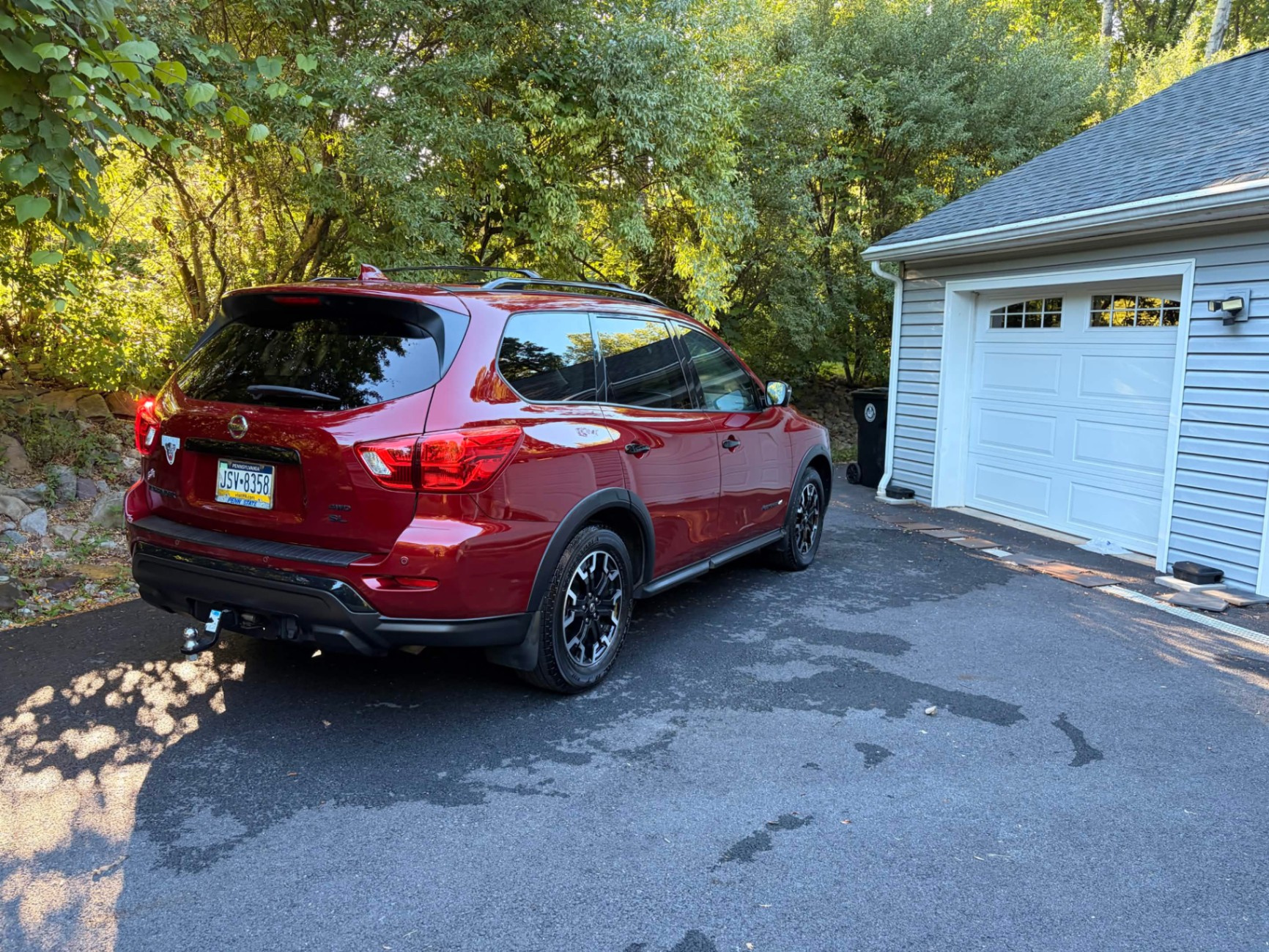 Red Nissan Pathfinder freshly detailed